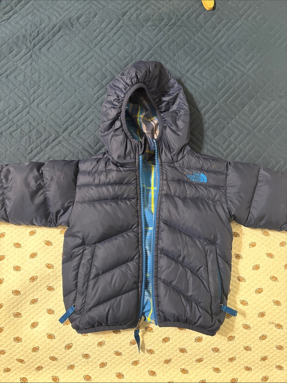 The North Face Kids Navy Hooded Puffer Jacket with Blue Zip Accents
